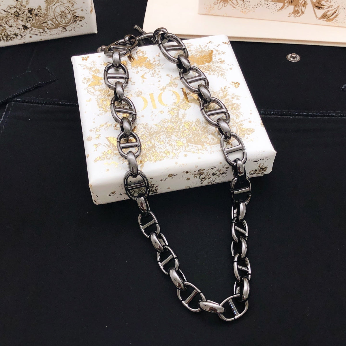 Martin Graham pendant necklace in polished metal-tone – front view