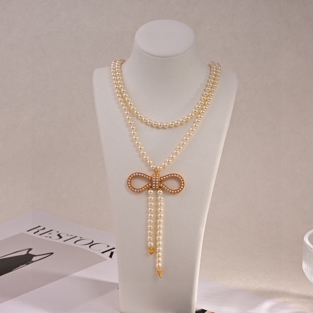 Martin Graham pendant necklace in polished metal-tone – front view