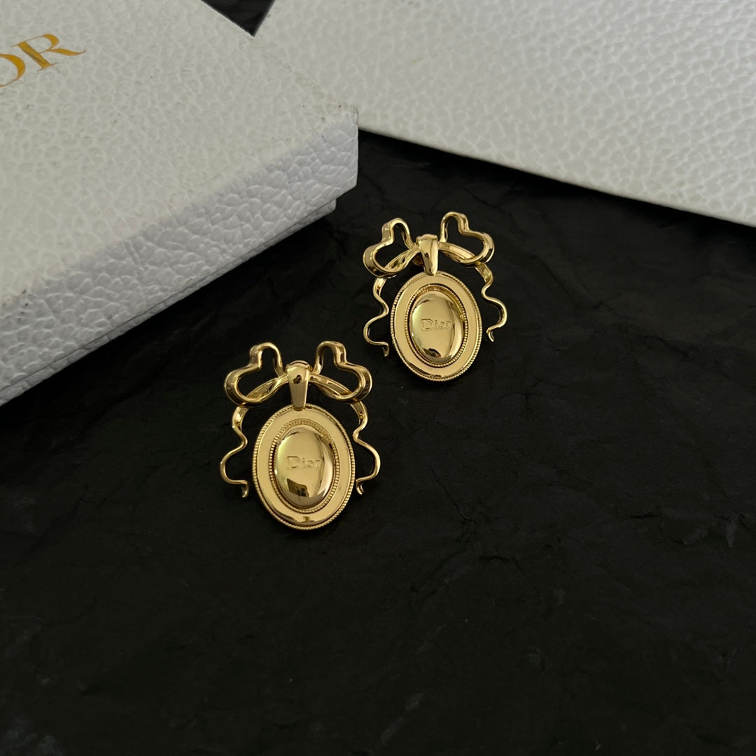 Martin Graham stud earrings in polished metal-tone – front view