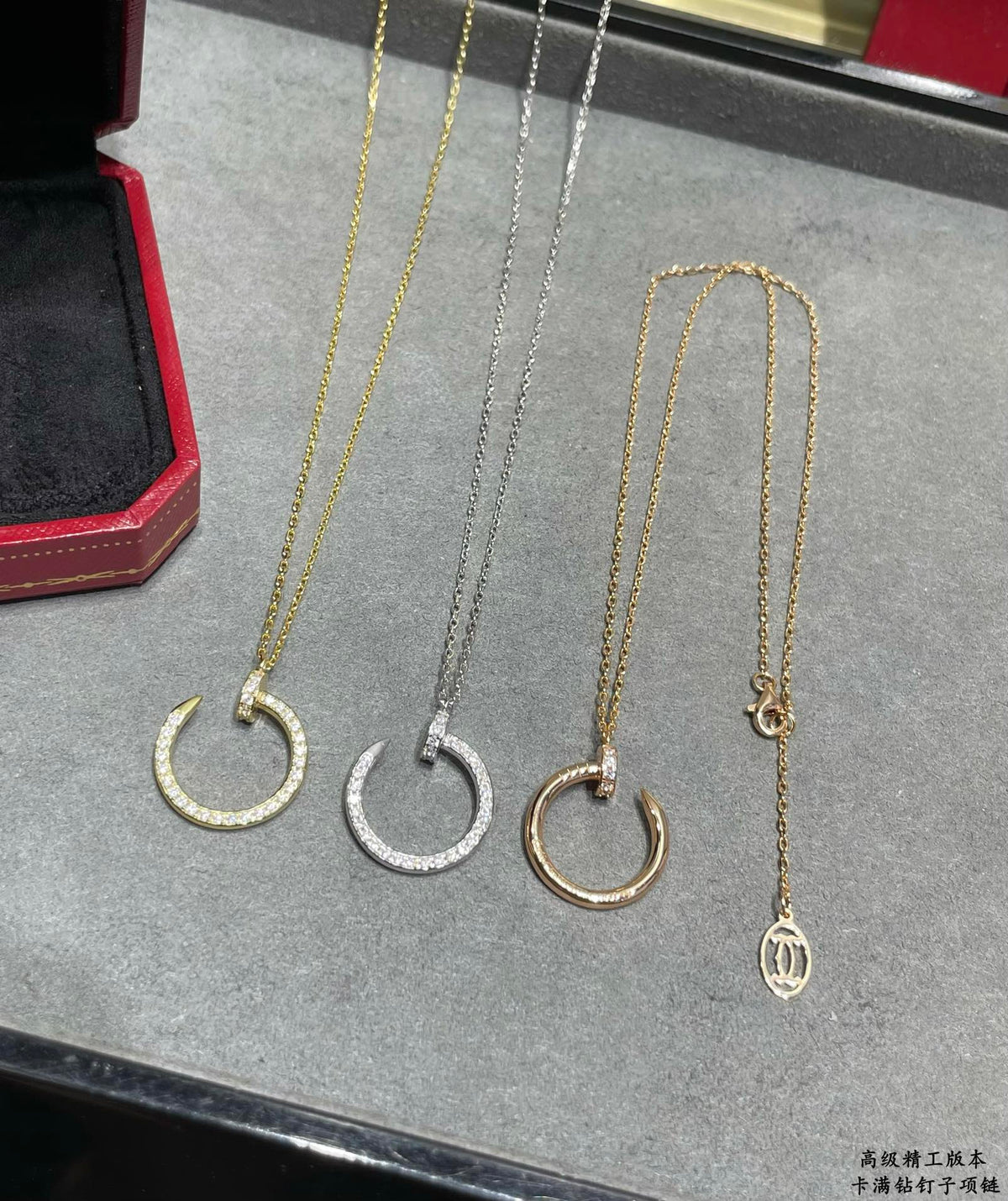 Martin Graham pendant necklace in polished metal-tone – front view