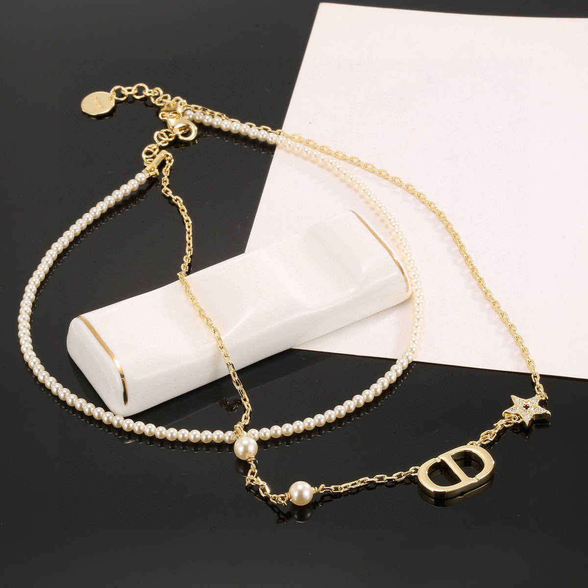 Martin Graham pendant necklace in polished metal-tone – front view