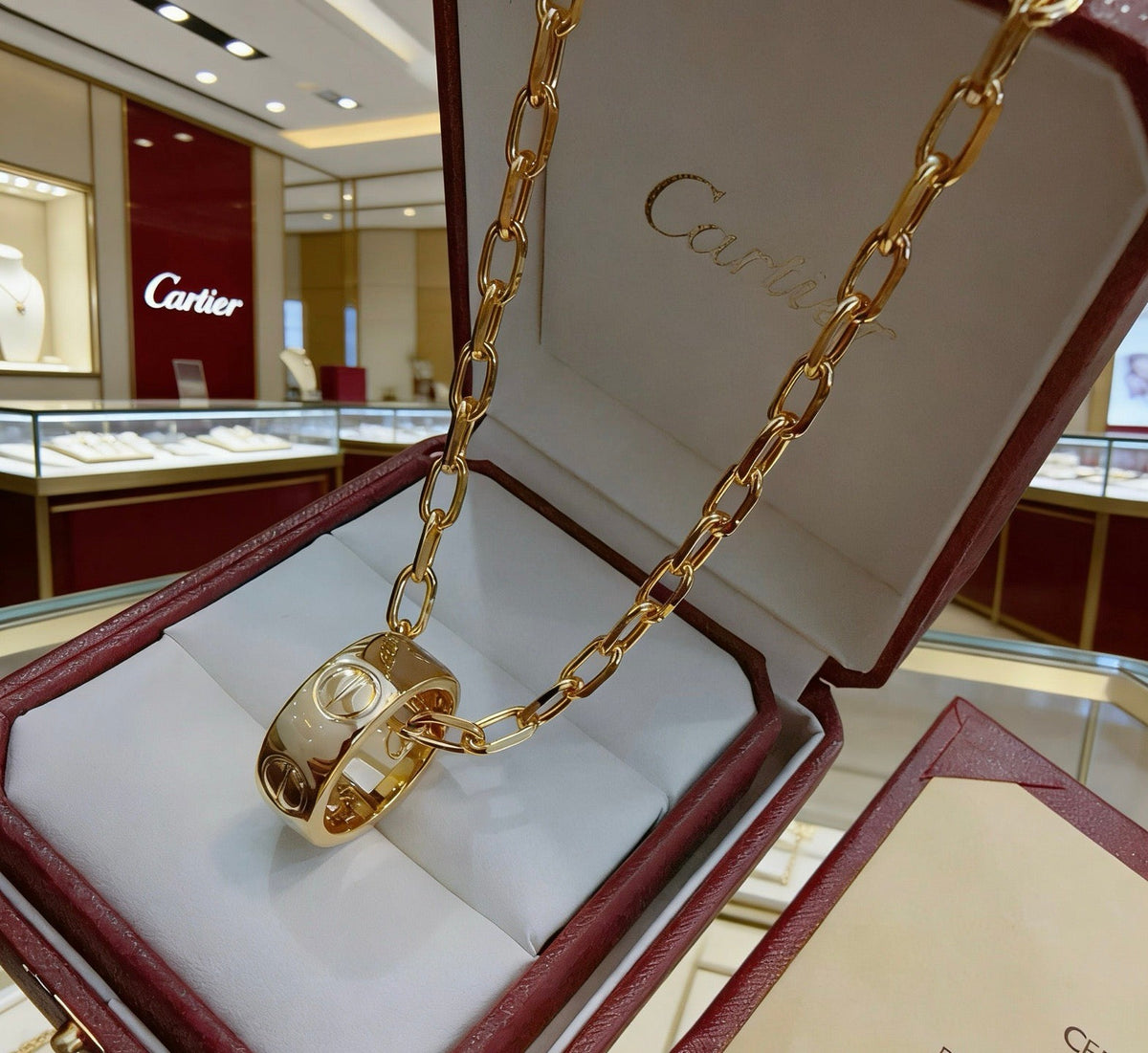 Martin Graham pendant necklace in polished metal-tone – front view