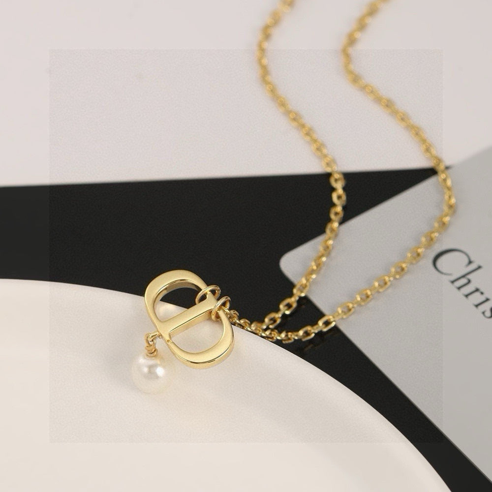 Martin Graham pendant necklace in polished metal-tone – front view