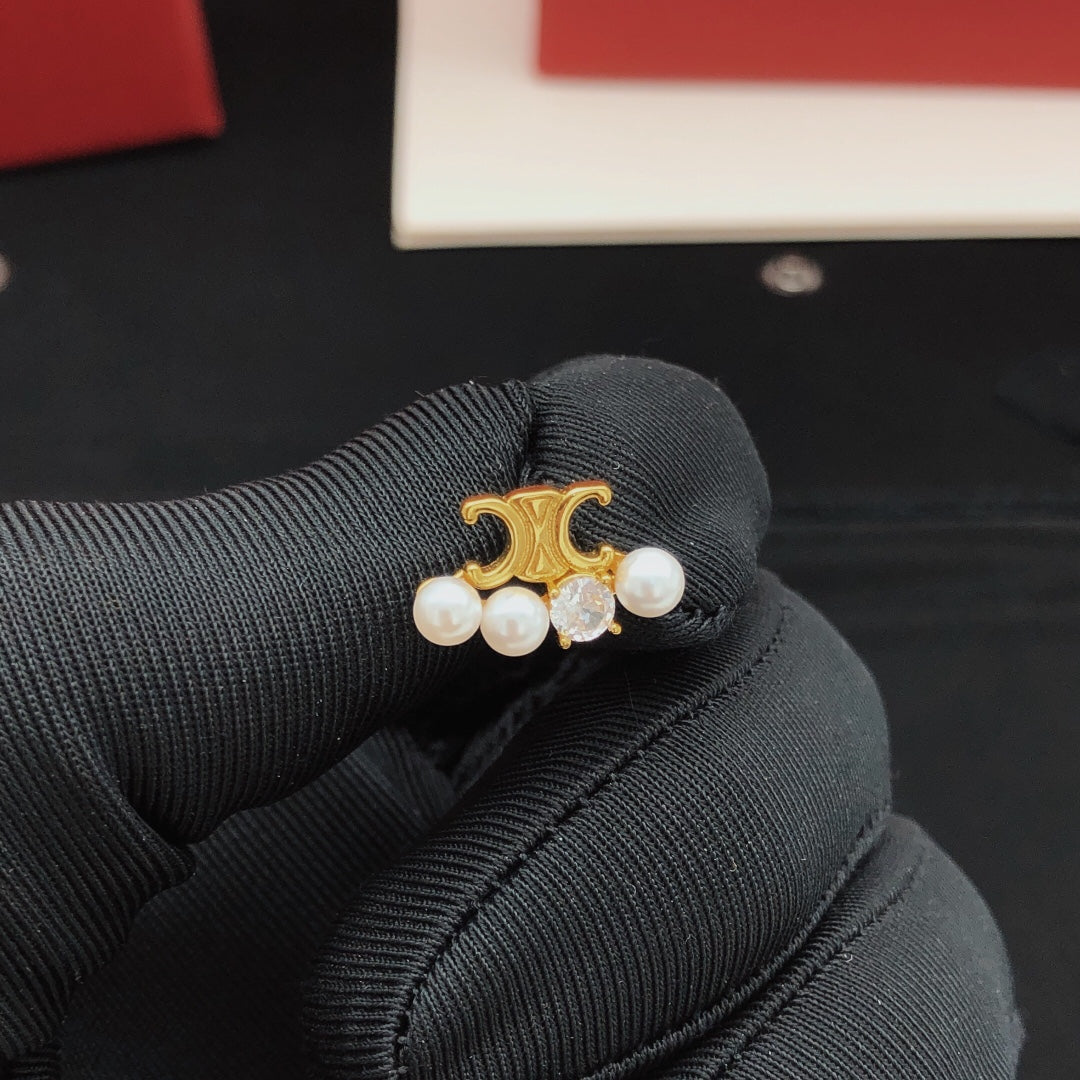 Martin Graham stud earrings in polished metal-tone – front view