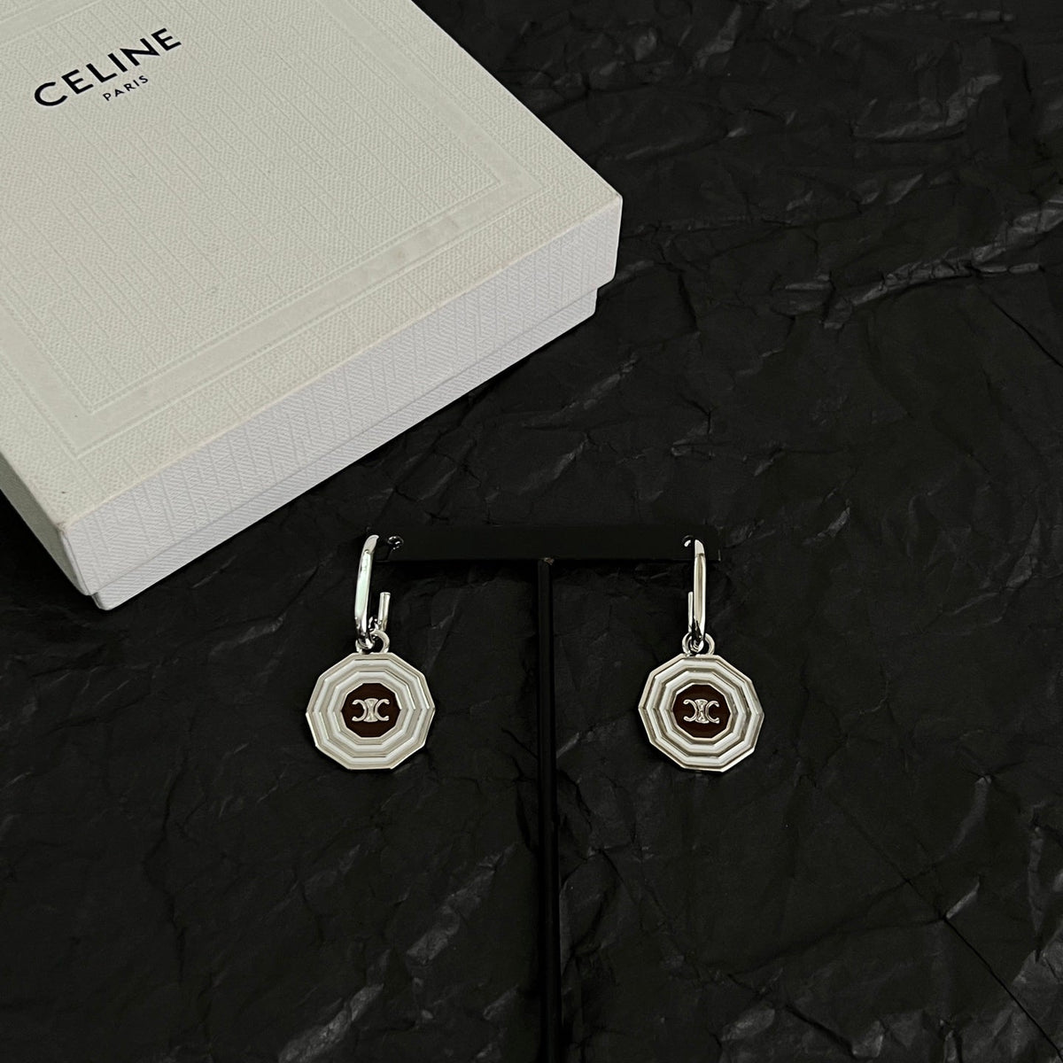 Martin Graham stud earrings in polished metal-tone – front view