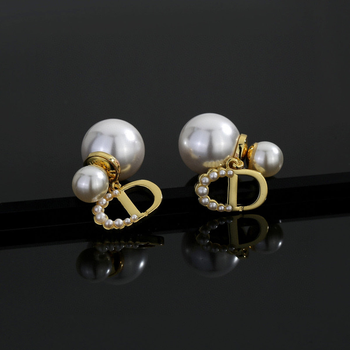 Martin Graham stud earrings in polished metal-tone – front view