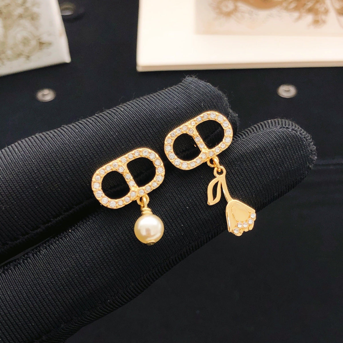 Martin Graham stud earrings in polished metal-tone – front view