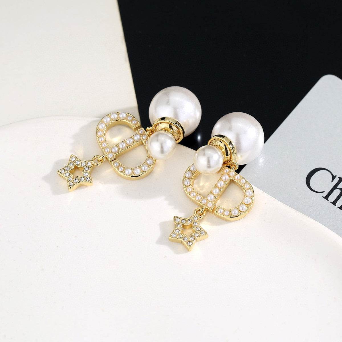 Martin Graham stud earrings in polished metal-tone – front view