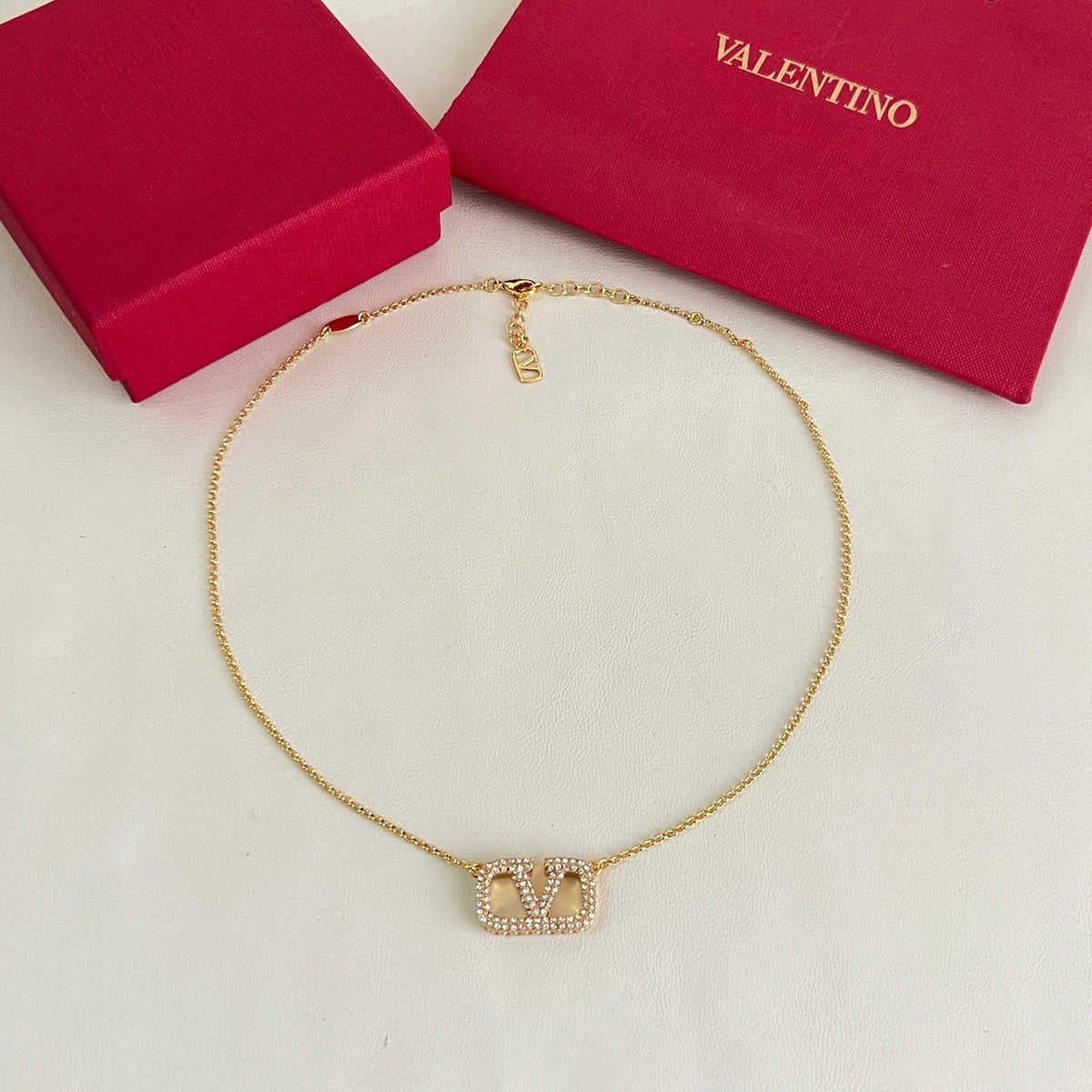 Martin Graham pendant necklace in polished metal-tone – front view