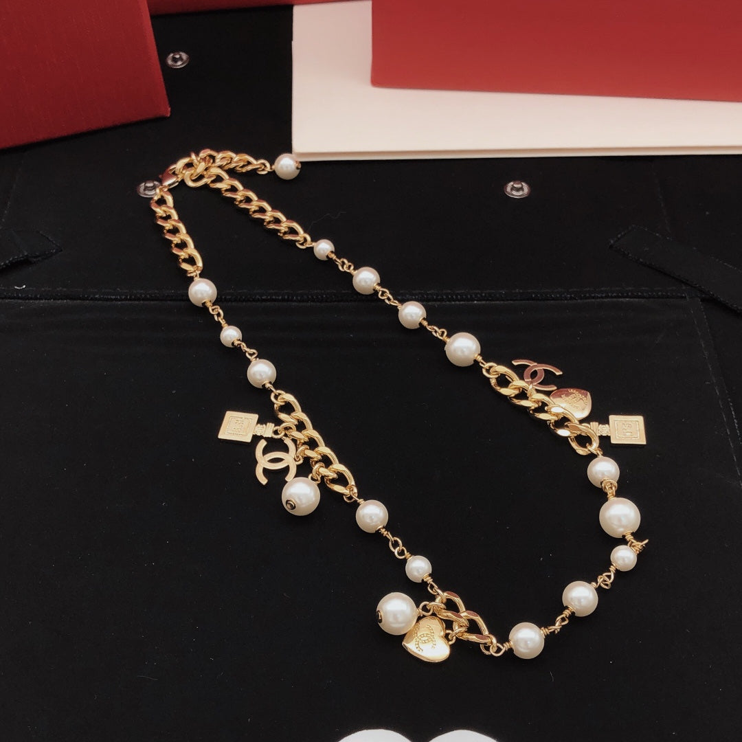 Martin Graham pendant necklace in polished metal-tone – front view