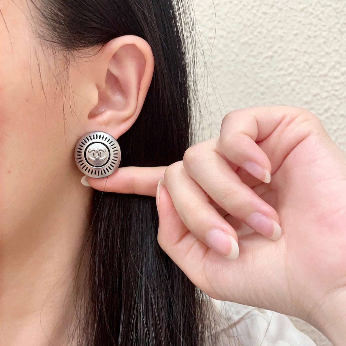 Martin Graham stud earrings in polished metal-tone – front product view