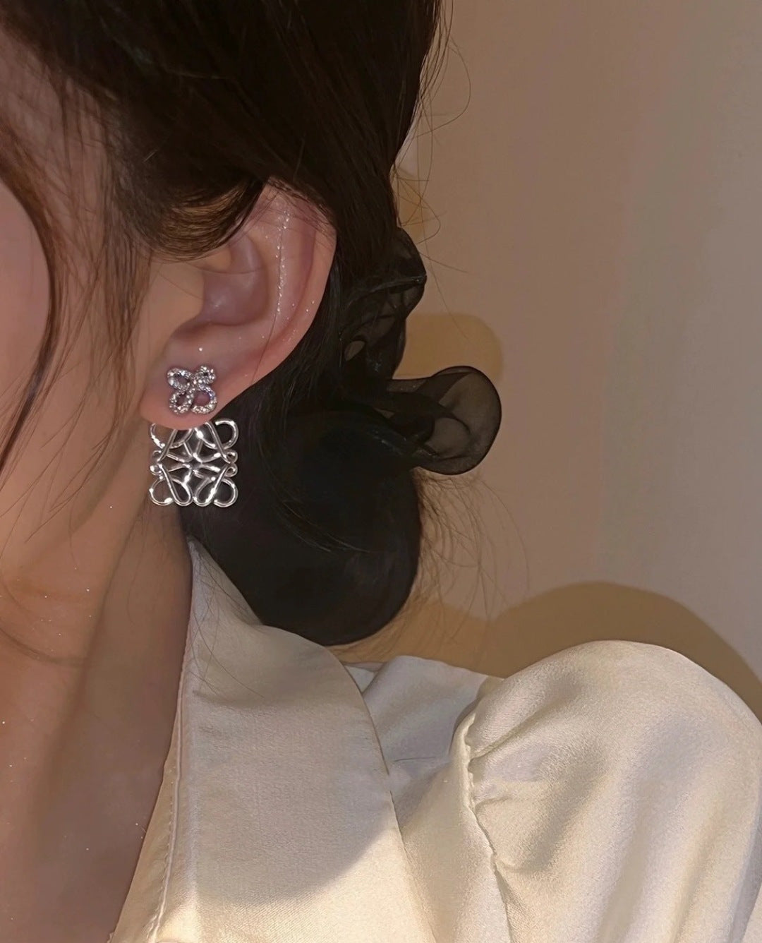 Martin Graham stud earrings in polished metal-tone – front view