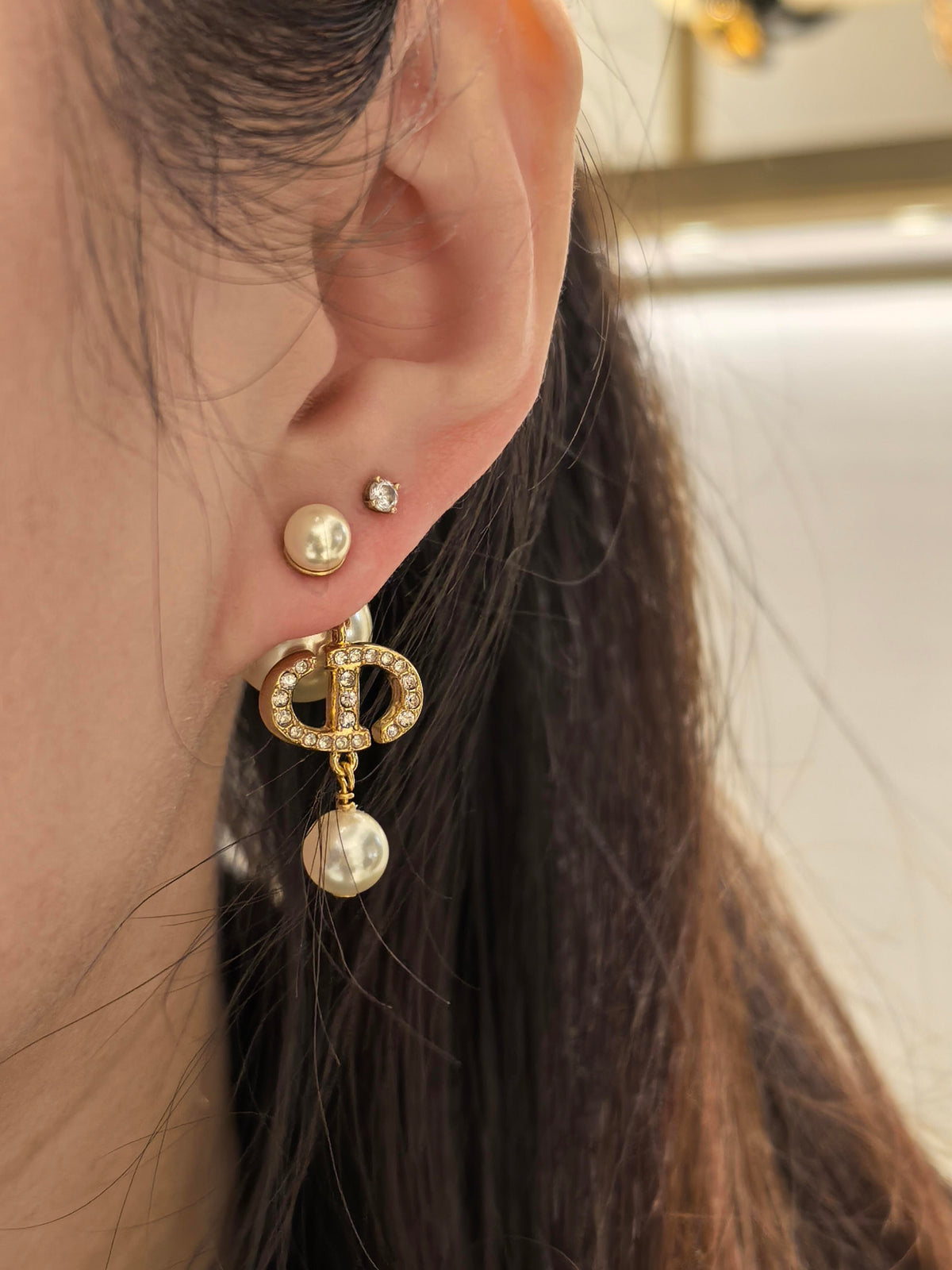 Martin Graham stud earrings in polished metal-tone – front view