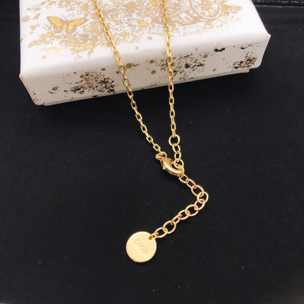 Martin Graham pendant necklace in polished metal-tone – front view