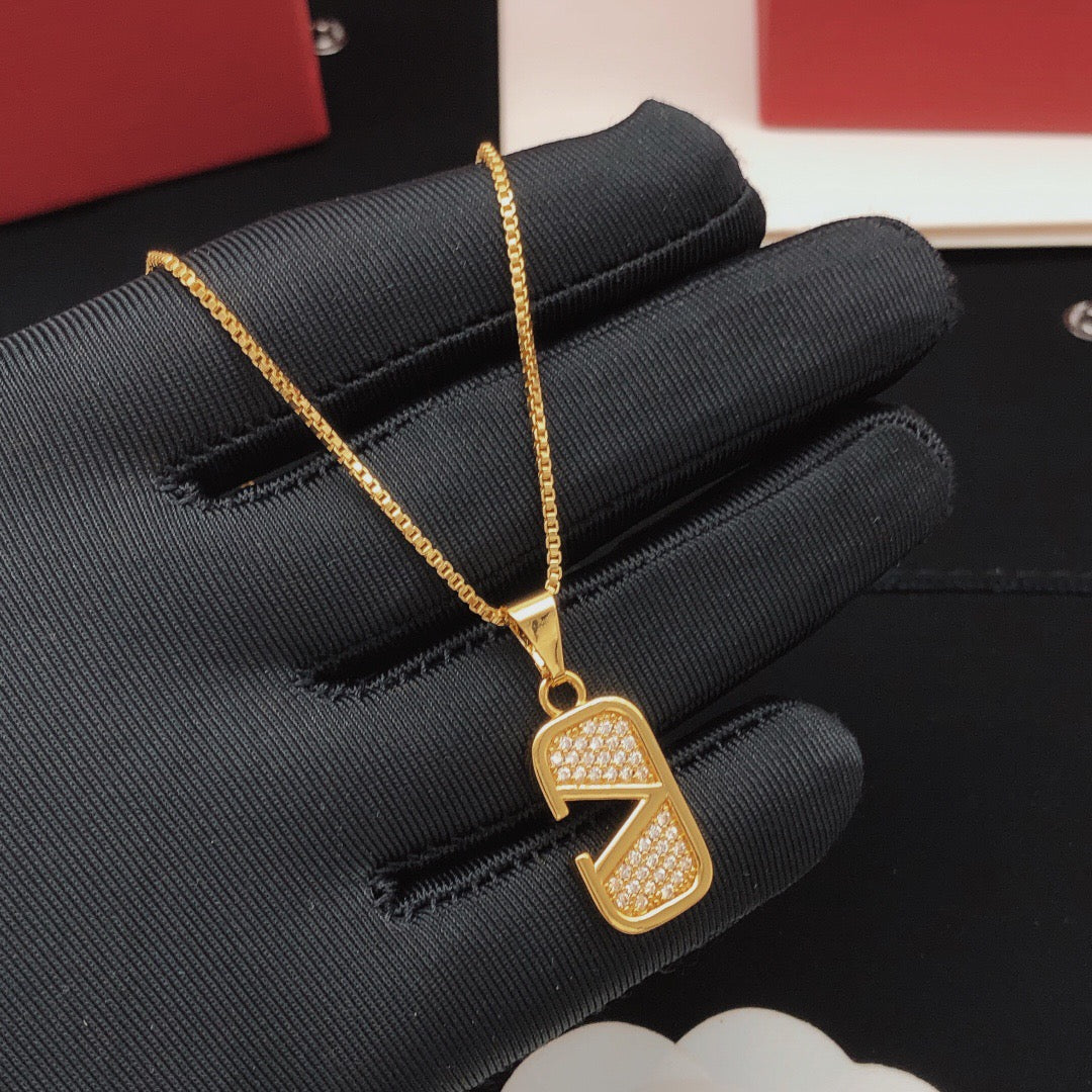 Martin Graham pendant necklace in polished metal-tone – front view
