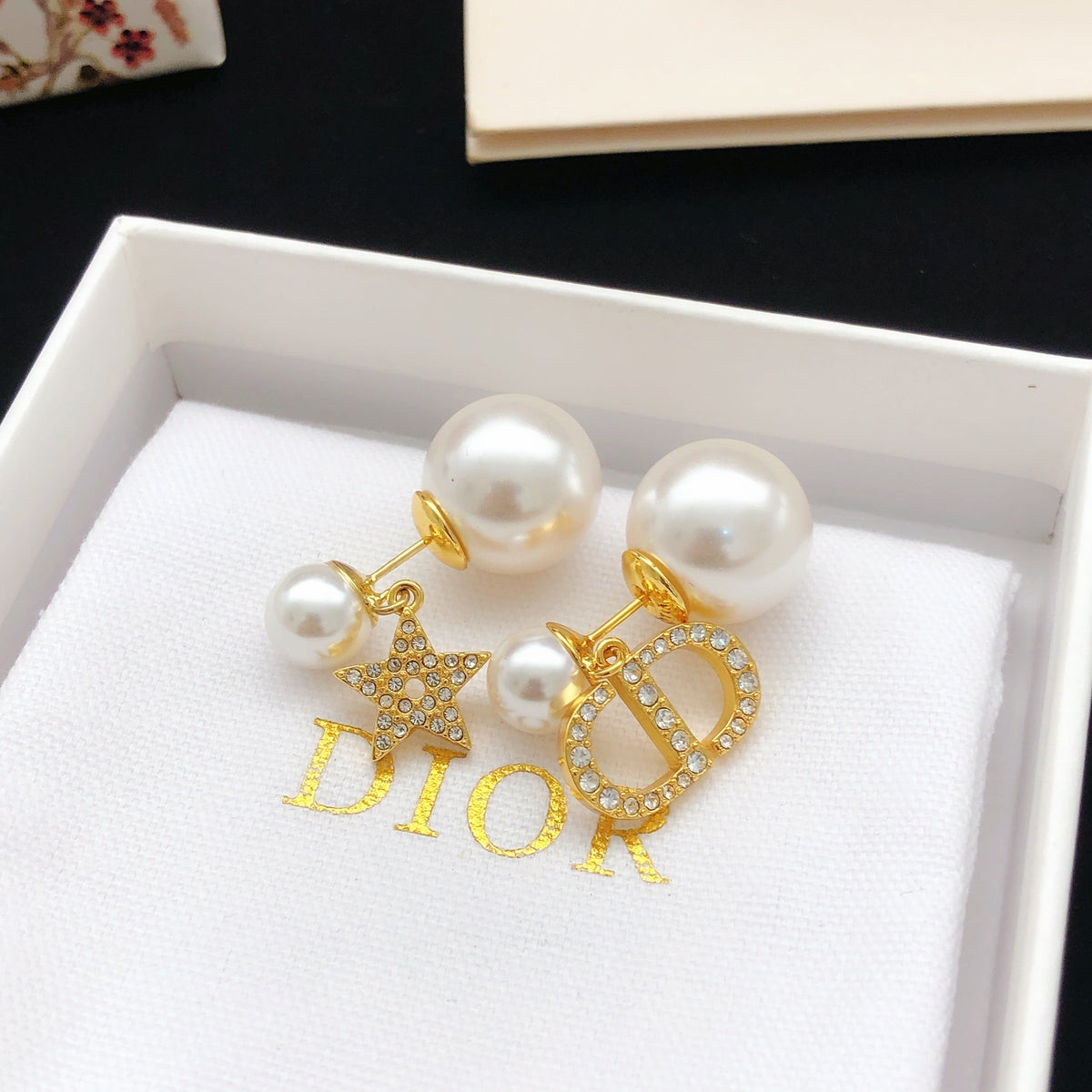 Martin Graham stud earrings in polished metal-tone – front view