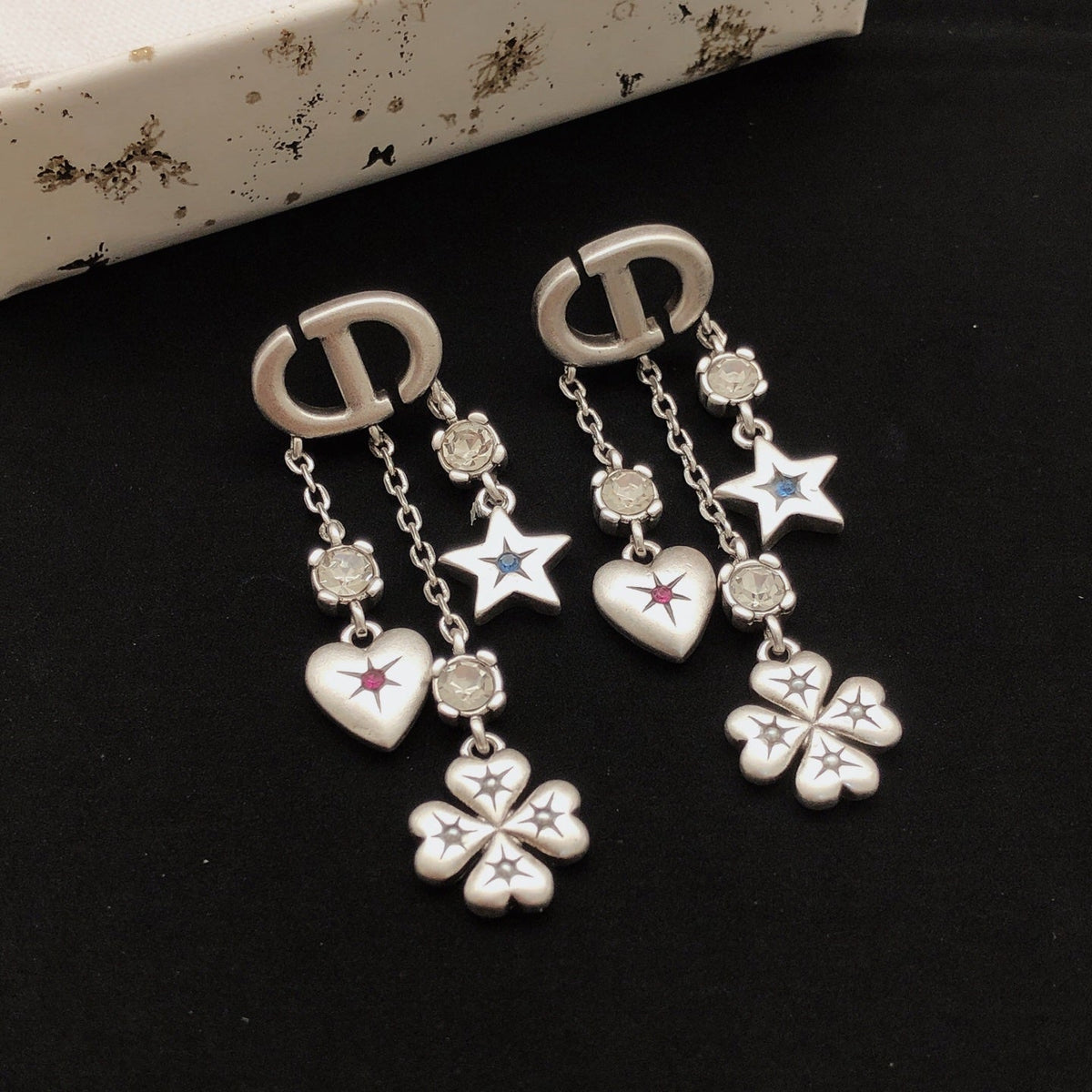 Martin Graham stud earrings in polished metal-tone – front view