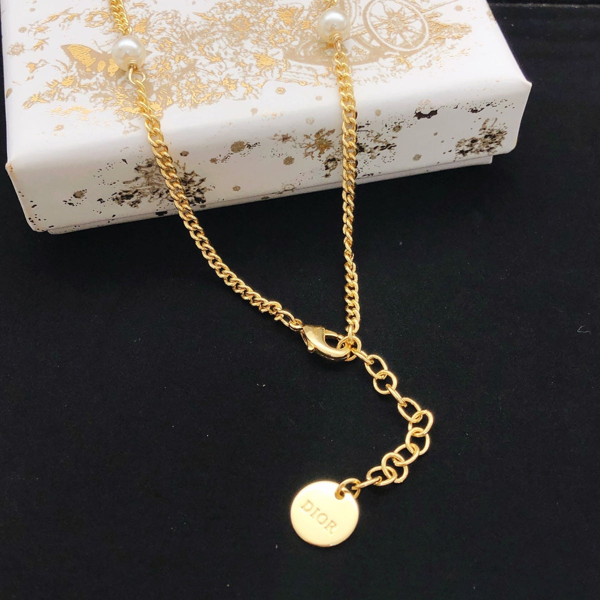 Martin Graham pendant necklace in polished metal-tone – front view