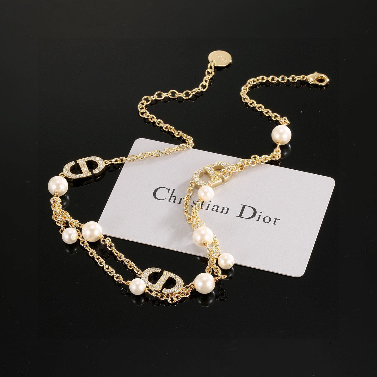 Martin Graham pendant necklace in polished metal-tone – front view