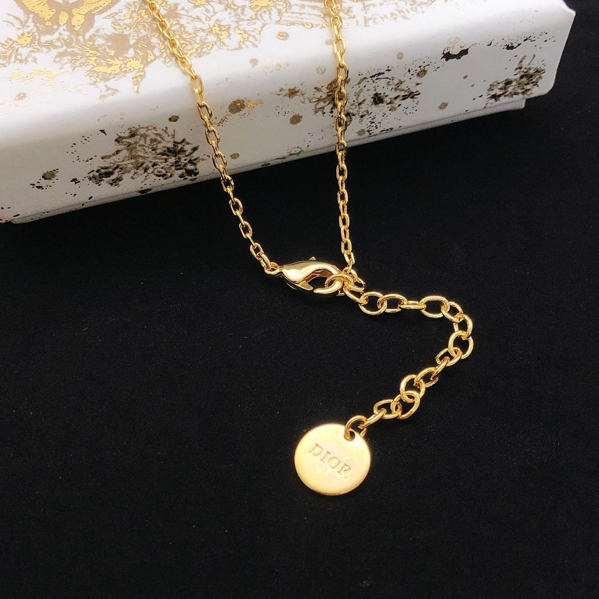 Martin Graham pendant necklace in polished metal-tone – front view