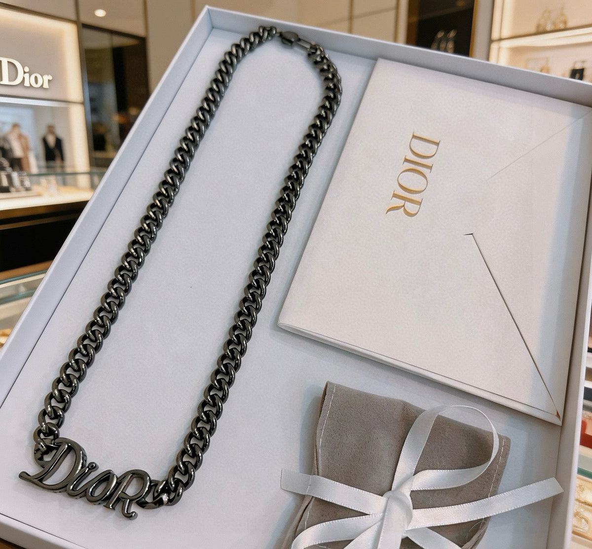 Martin Graham pendant necklace in polished metal-tone – front view