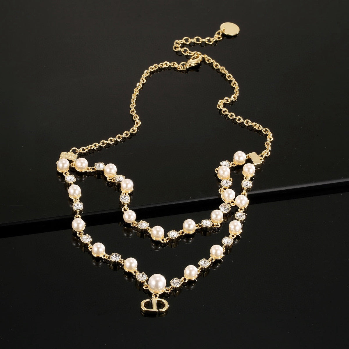 Martin Graham pendant necklace in polished metal-tone – front view