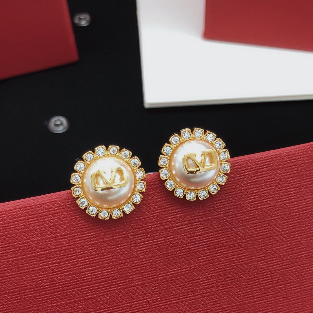 Martin Graham stud earrings in polished metal-tone – front view