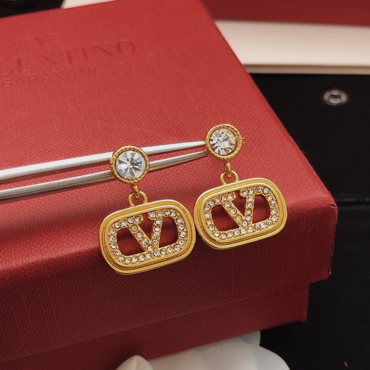 Martin Graham stud earrings in polished metal-tone – front view