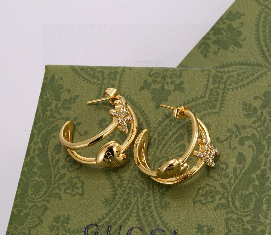 Martin Graham stud earrings in polished metal-tone – front view