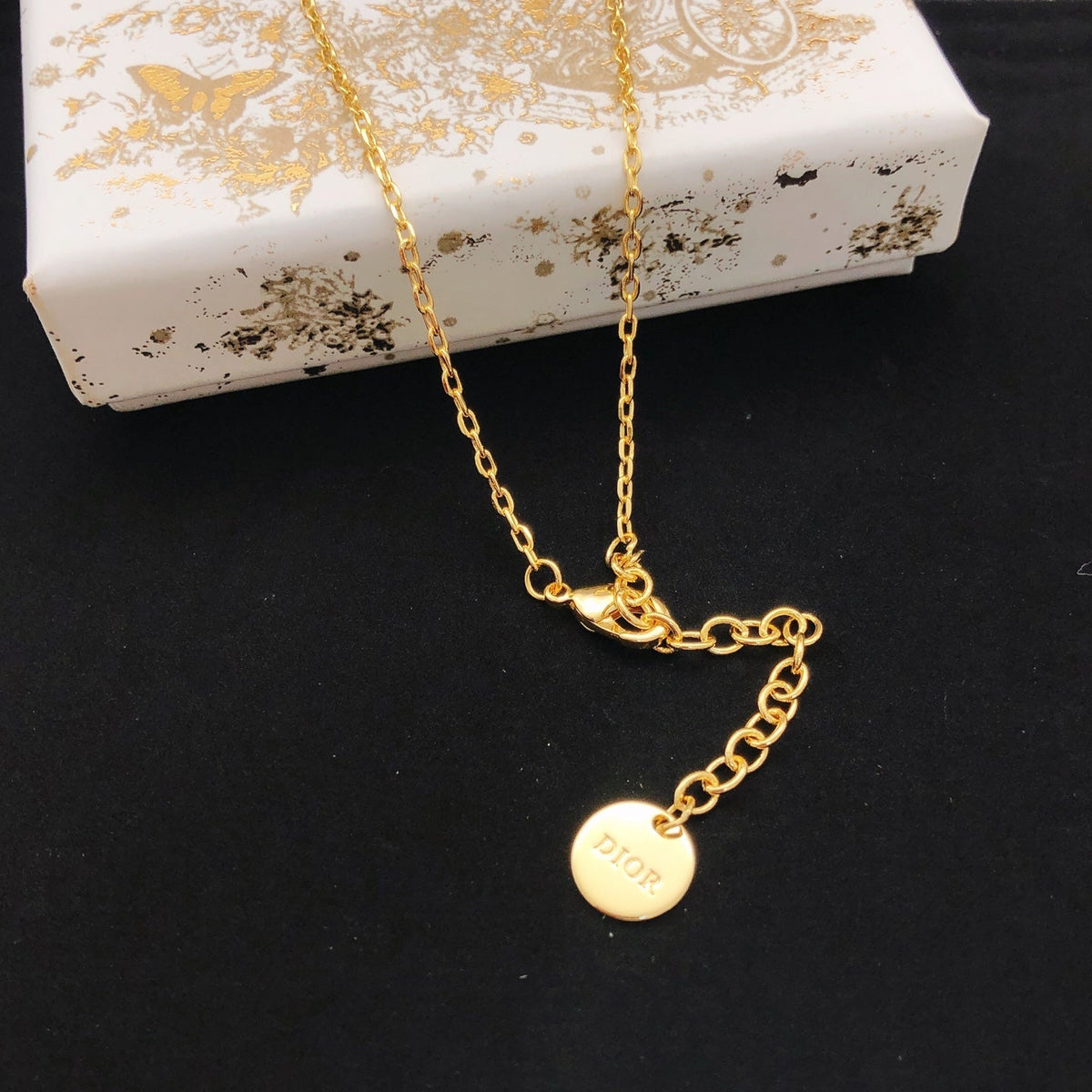 Martin Graham pendant necklace in polished metal-tone – front view