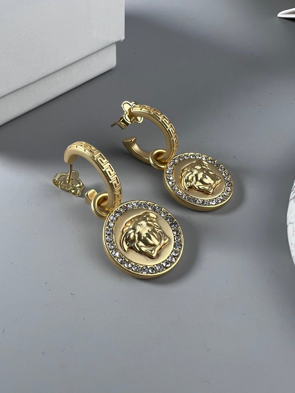 Martin Graham stud earrings in polished metal-tone – front product view