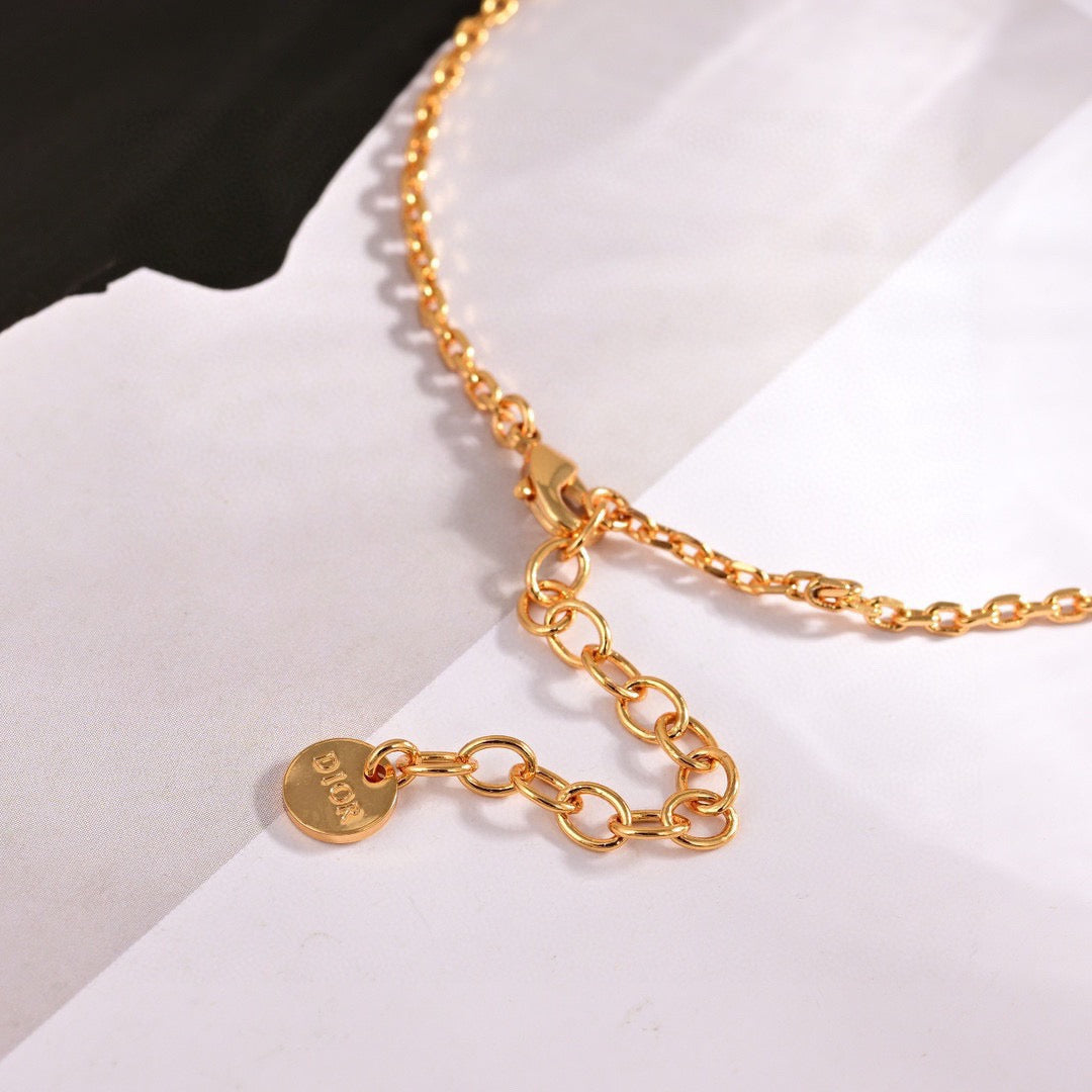Martin Graham pendant necklace in polished metal-tone – front view