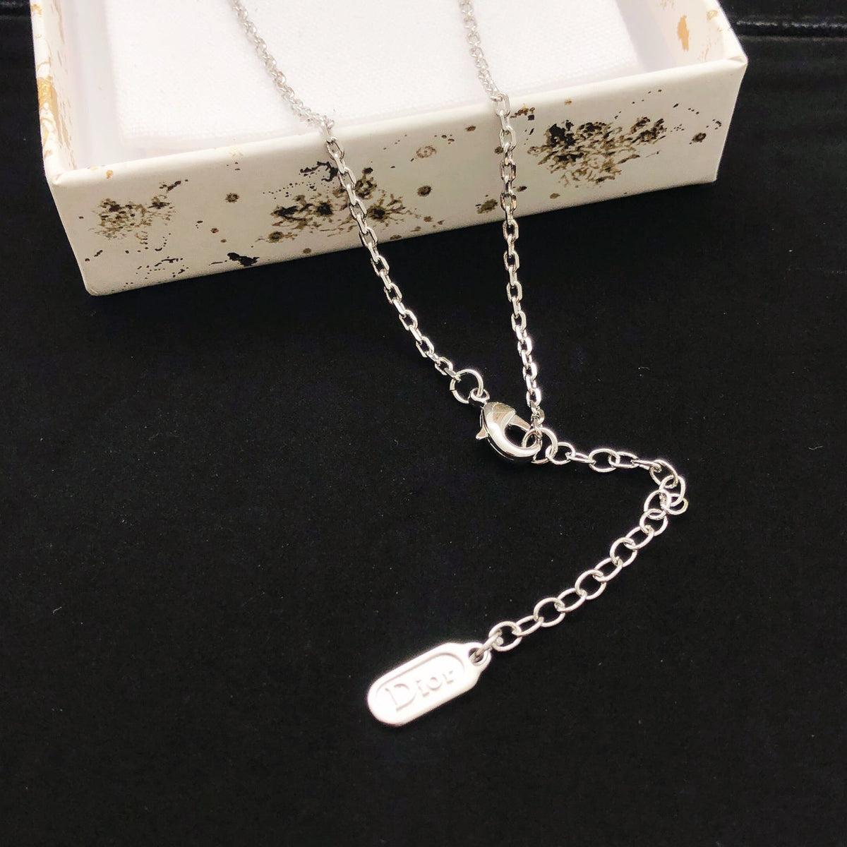 Martin Graham pendant necklace in polished metal-tone – front view