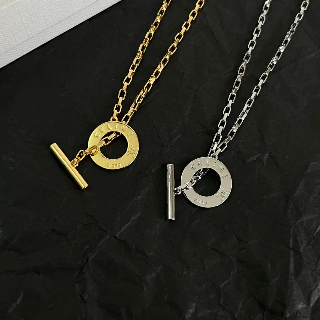 Martin Graham pendant necklace in polished metal-tone – front view