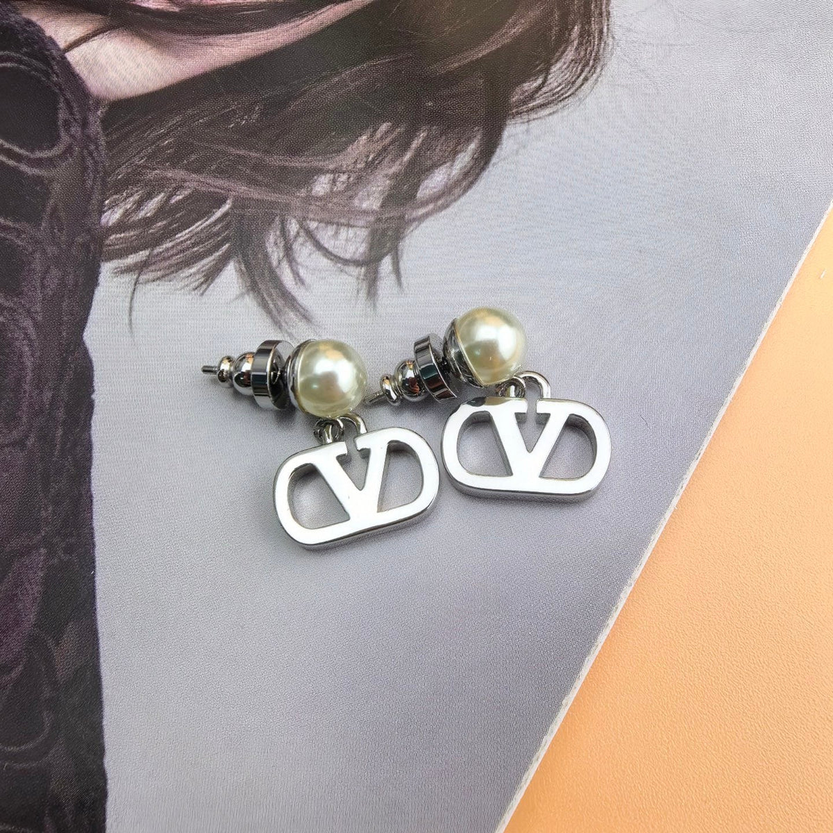 Martin Graham stud earrings in polished metal-tone – front view