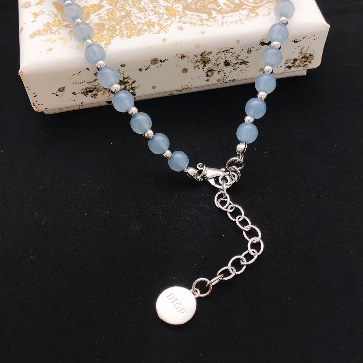 Martin Graham pendant necklace in polished metal-tone – front view