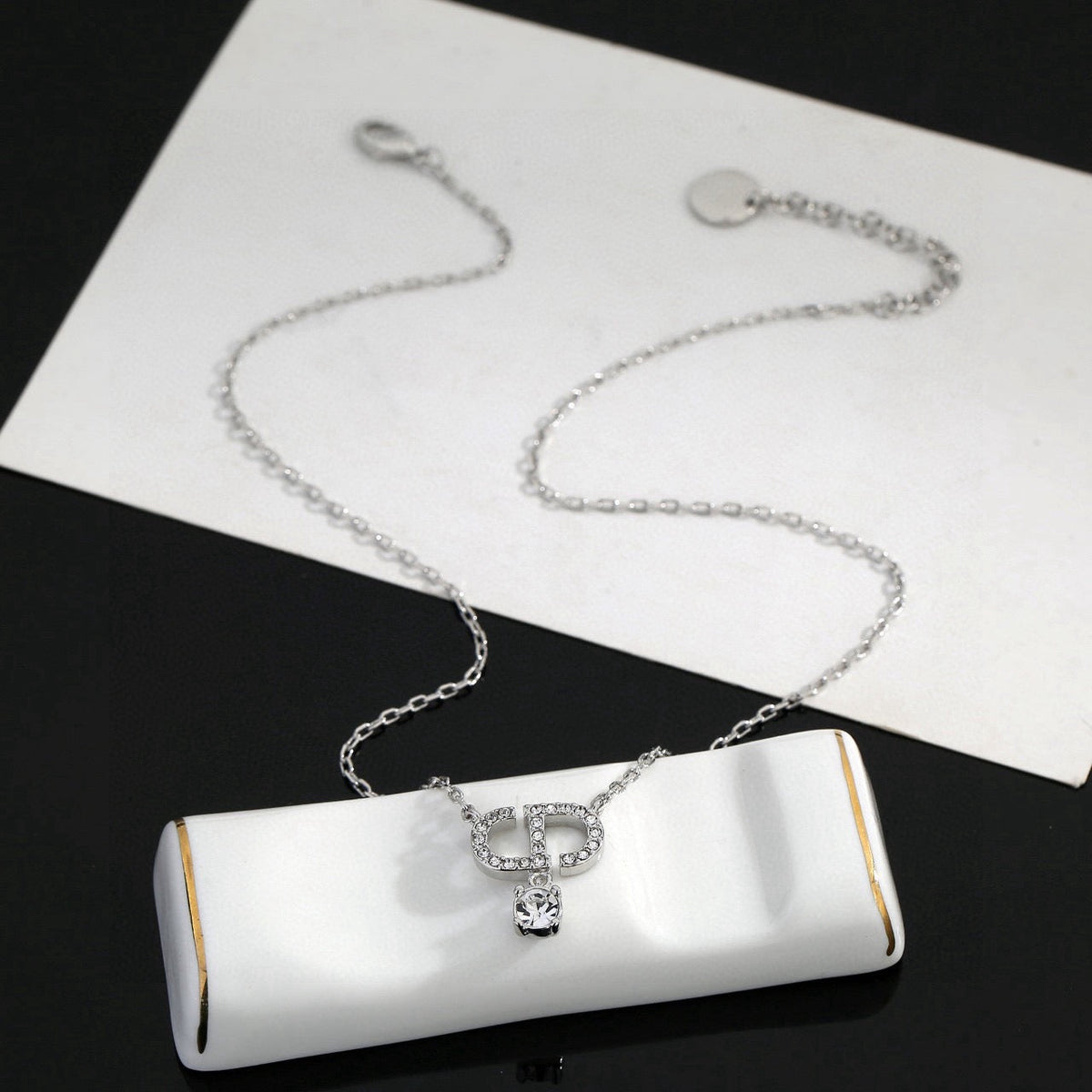 Martin Graham pendant necklace in polished metal-tone – front view