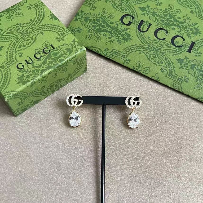 Martin Graham stud earrings in polished metal-tone – front product view