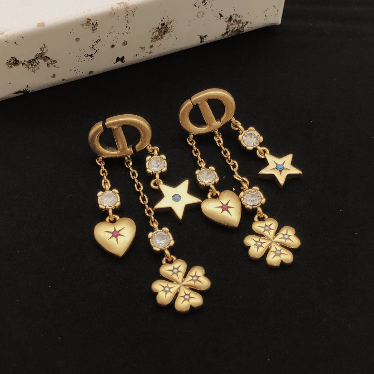 Martin Graham stud earrings in polished metal-tone – front view