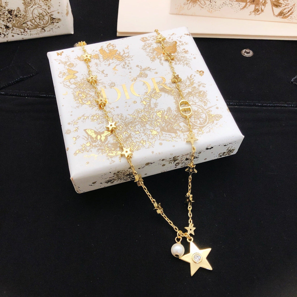 Martin Graham pendant necklace in polished metal-tone – front view