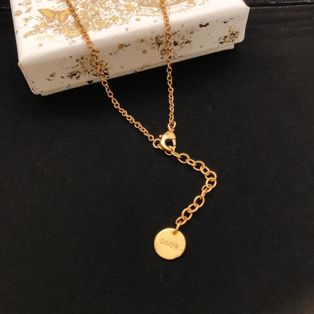 Martin Graham pendant necklace in polished metal-tone – front view