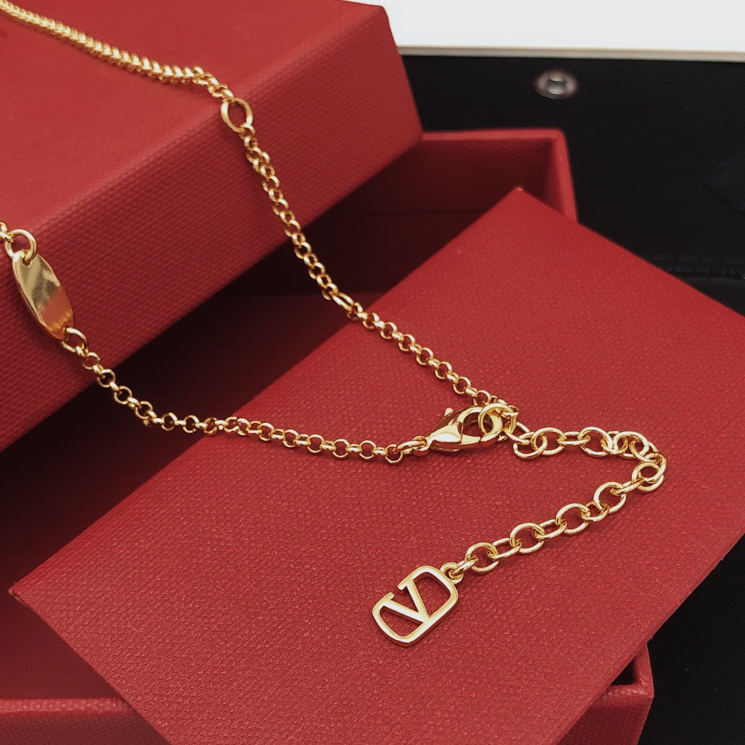 Martin Graham pendant necklace in polished metal-tone – front view