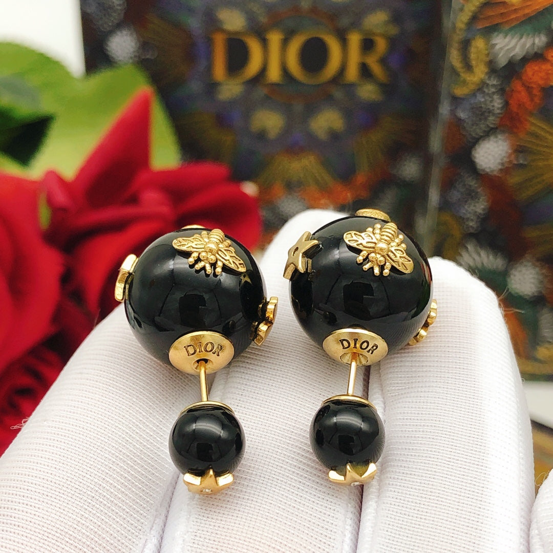 Martin Graham stud earrings in polished metal-tone – front view