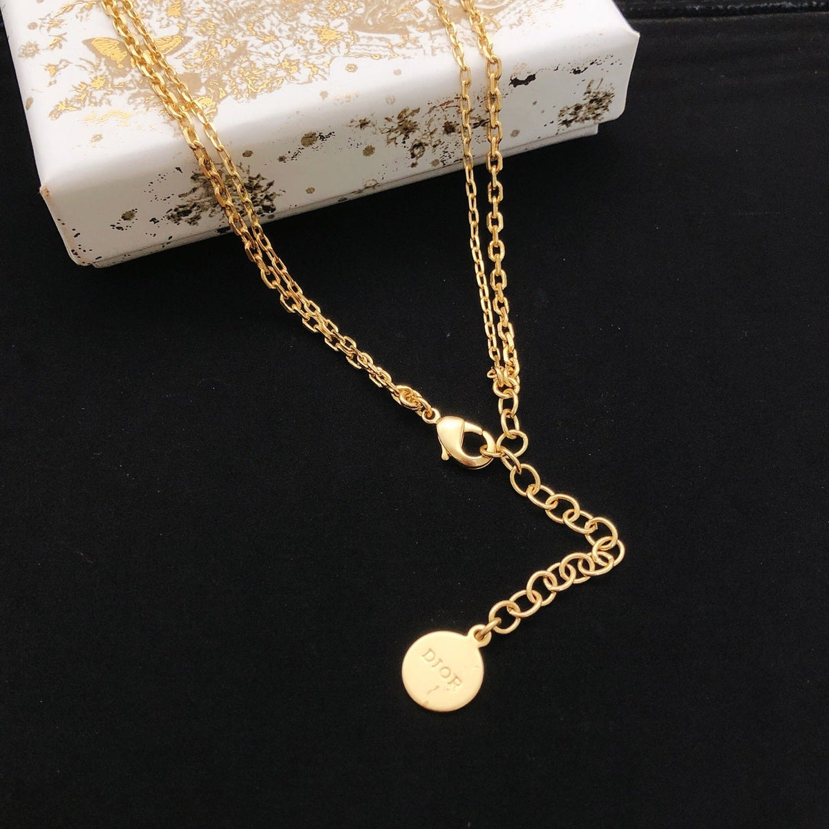 Martin Graham pendant necklace in polished metal-tone – front view