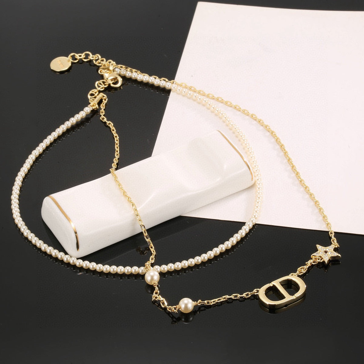 Martin Graham pendant necklace in polished metal-tone – front view