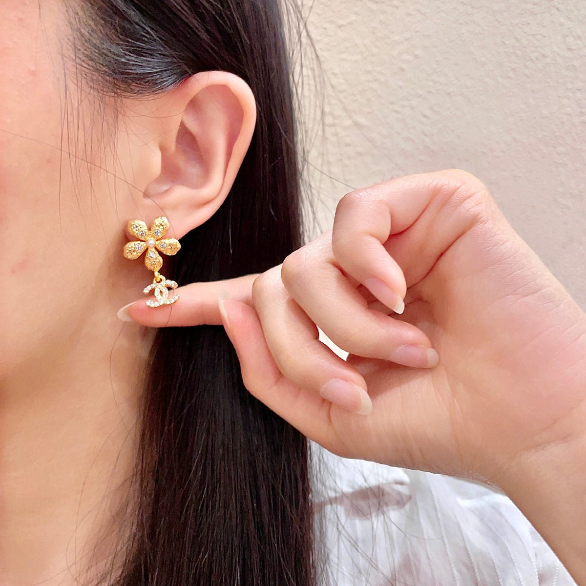 Martin Graham stud earrings in polished metal-tone – front product view