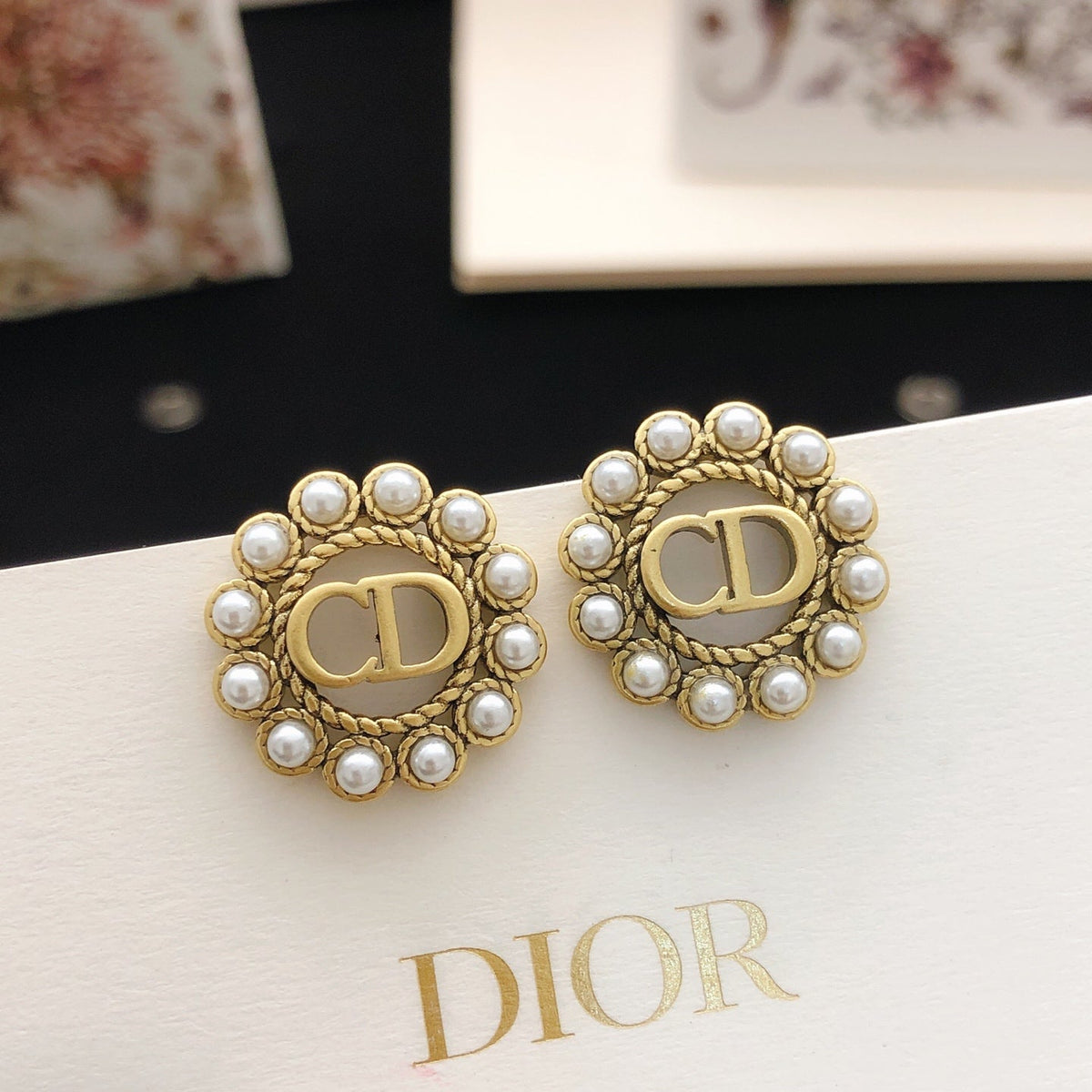 Martin Graham stud earrings in polished metal-tone – front view