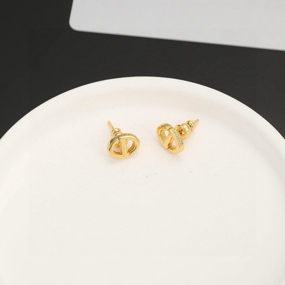 Martin Graham stud earrings in polished metal-tone – front view
