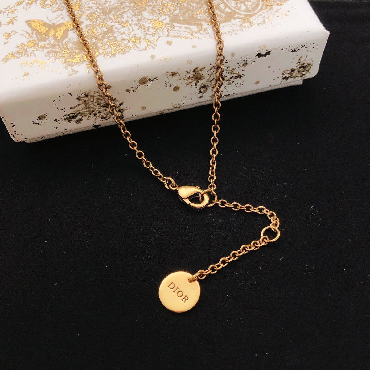 Martin Graham pendant necklace in polished metal-tone – front view