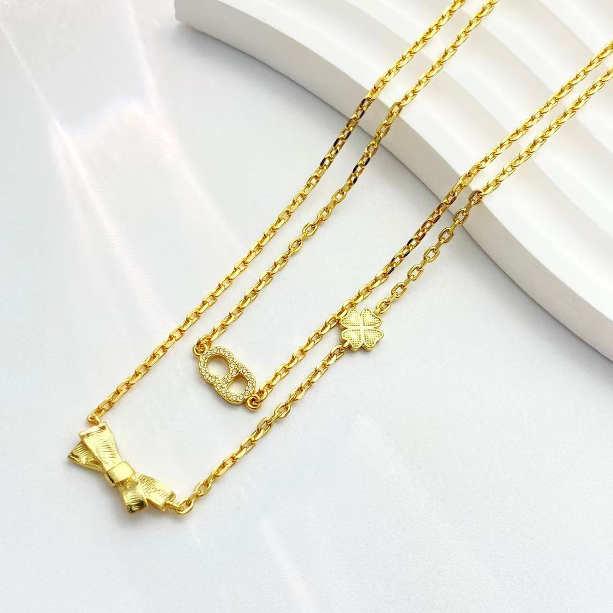 Martin Graham pendant necklace in polished metal-tone – front view